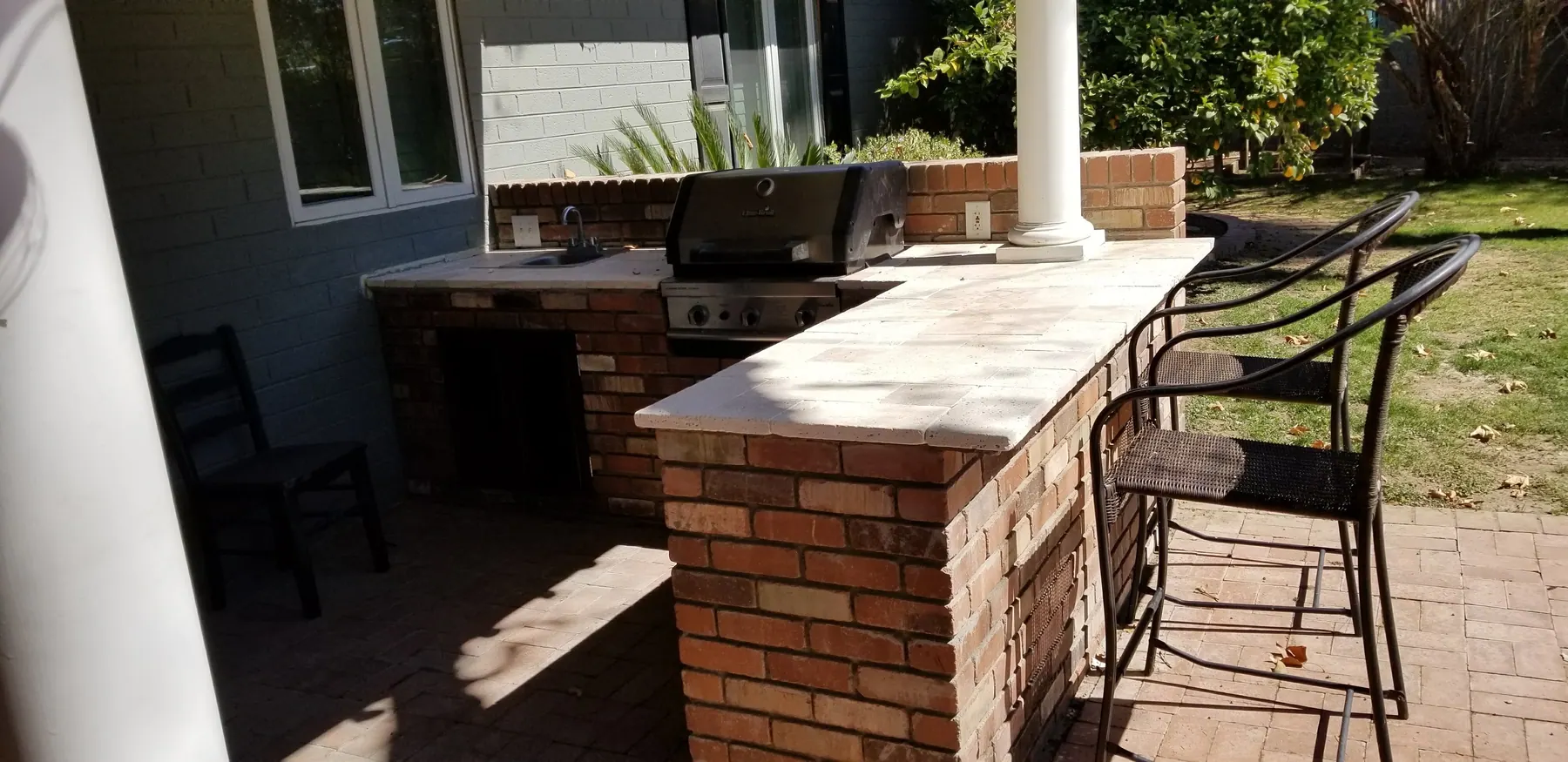 Stucco fireplace + patio